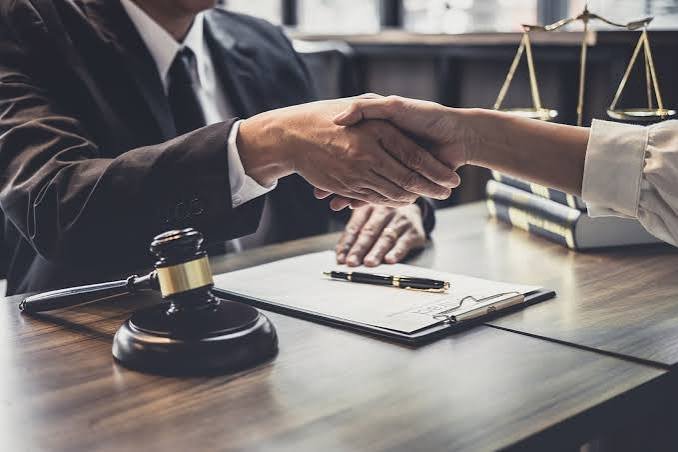 Attorney and client shaking hands